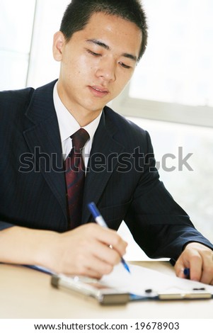 young handsome asian business man working  in office