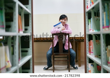 young asian girl in library