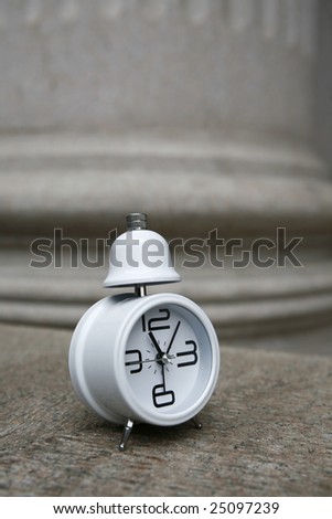 white clock before bank building