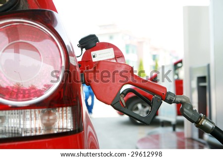 close-up of  refilling the car with a gas pump