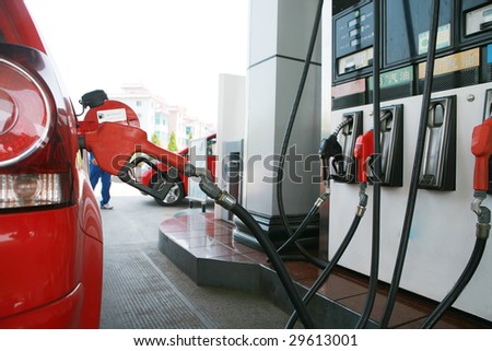 close-up of  refilling the car with a gas pump