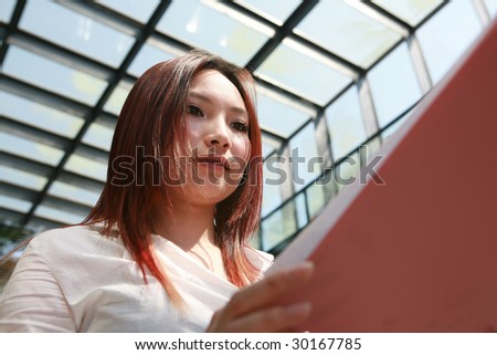 young asian business women holding folder
