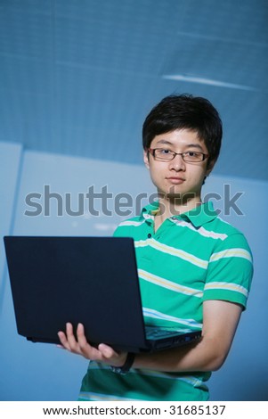 asian  student boy with laptop