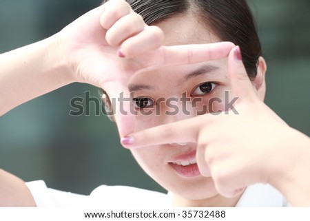 Pretty young asian woman showing thinking outside the square