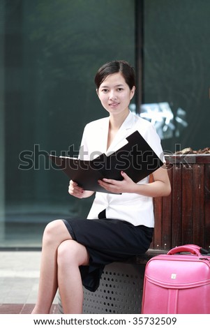 young asian business woman holding with folder