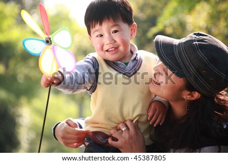 chinese boy and his mother at garden