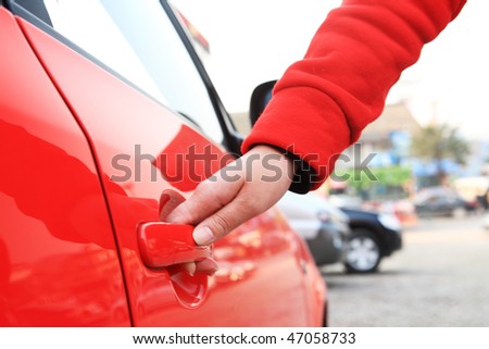 girl want open door of red car outside