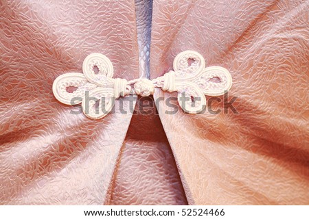 traditional Chinese Red knot buttons on silk dress with beautiful patterns