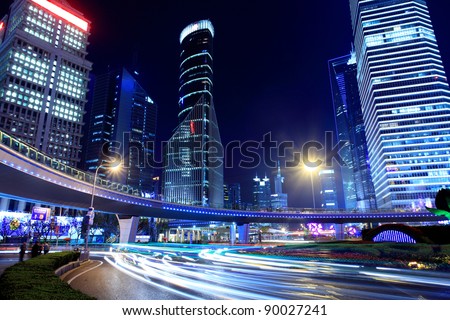 traffic through modern city at night in shanghai