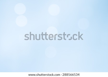 LIGHT BLUE BACKGROUND WITH BLURRED LIGHTS