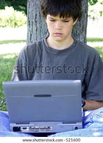teenager and computer, concentrating