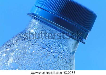 Water bottle neck against blue sky
