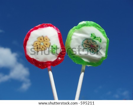 Lollipops against blue sky â€“ red, green and yellow