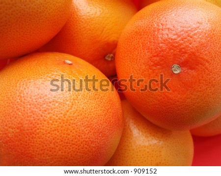 Many orange fruits in a close-up