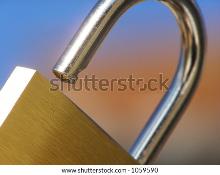 Close-up of padlock against colourful blurred background