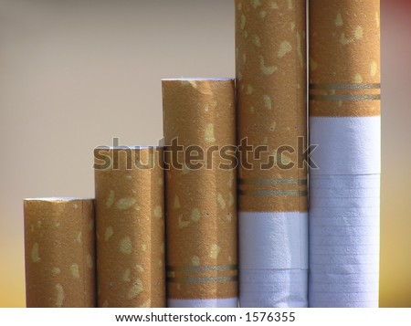 Close-up of end of cigarettes with filter and a colored background