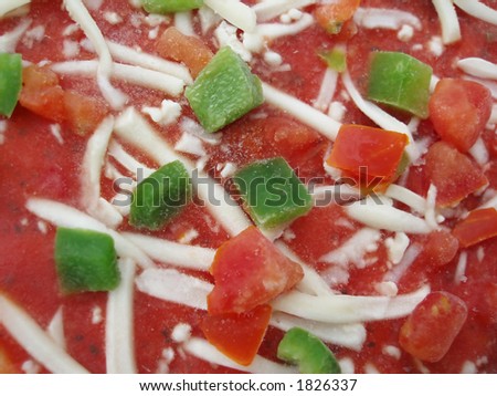 Close-up of frozen pizza as a colourful background
