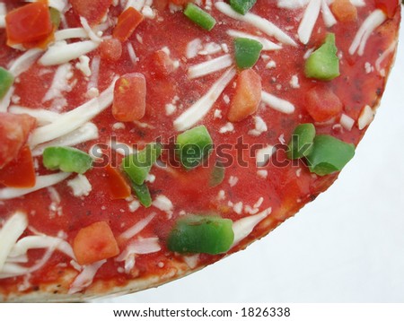Close-up of frozen pizza on white background