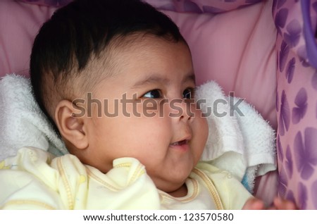 Closeup portrait of a 3 month old baby laugh
