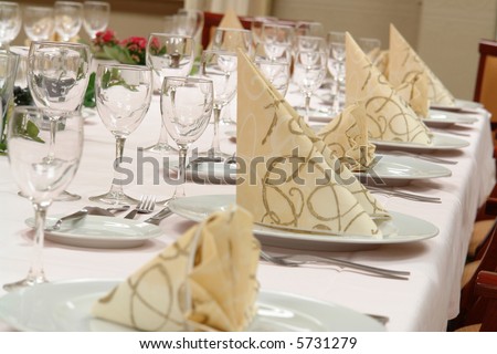 table setting large dinner table set up for a lot of people