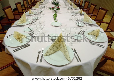 table setting large dinner table set up for a lot of people