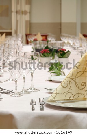 large dinner table set up for a lot of people
