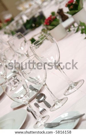 large dinner table set up for a lot of people