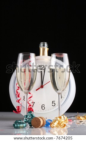 celebrating New Year, Champagne glasses, clock and confetti