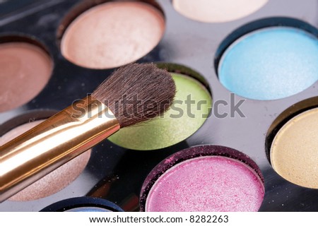 colorful makeup set and golden brush