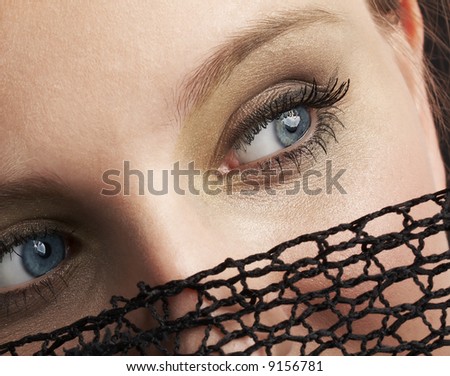 mysterious blue eyes, attractive woman hiding her face under black net veil