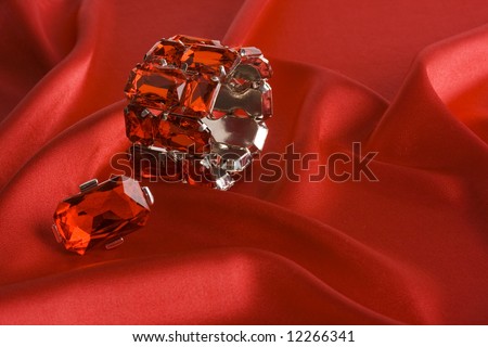 crystal bracelet and ring on red satin