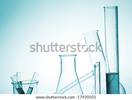 chemistry laboratory equipment, test tubes on green background