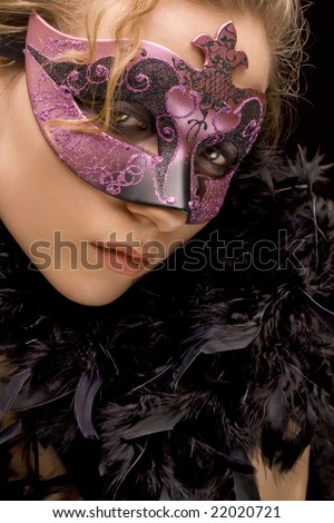 portrait of mysterious blond woman wearing purple stylish carnival mask and black feathers, role play
