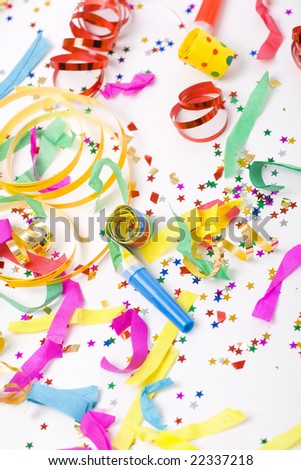colorful spirals, small confetti stars and colorful blowers on white background, party time