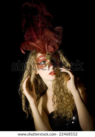 woman with Venetian mask and red feathers