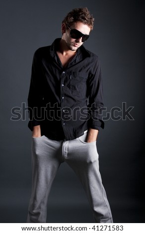 male model posing in trendy clothes