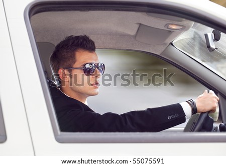 young businessman in his car