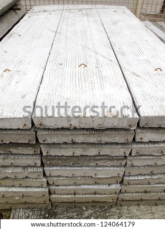 Stack of concrete building slab on ground in stock