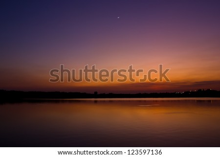 twilight with moon reflect water
