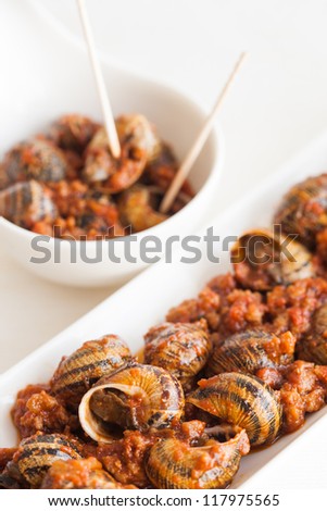 Tapas of cooked snails, typical spanish pub food, ready to eat!
