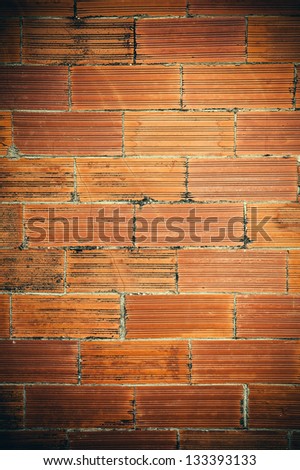 Old and damaged brick wall making background.