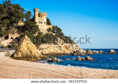 Landscape of Lloret de Mar Castle and its beach in a sunny afternoon.