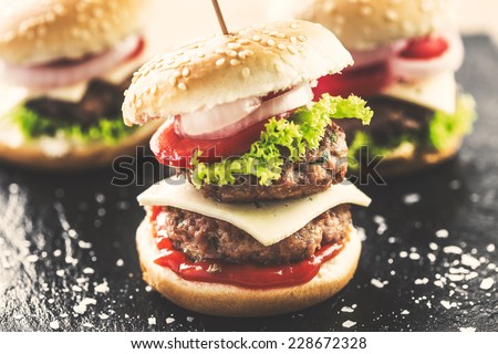 Mini double burgers appetizer, vintage look food.