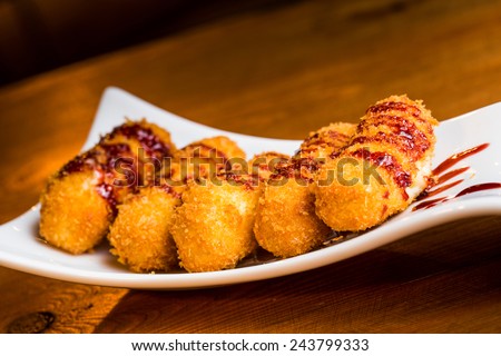 Typical spanish pub food, croquettes with salad.