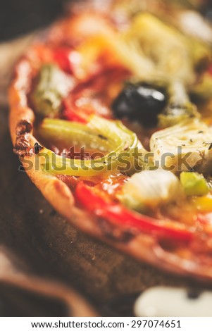 Top view of a healthy vegetables pizza. Vintage edition.