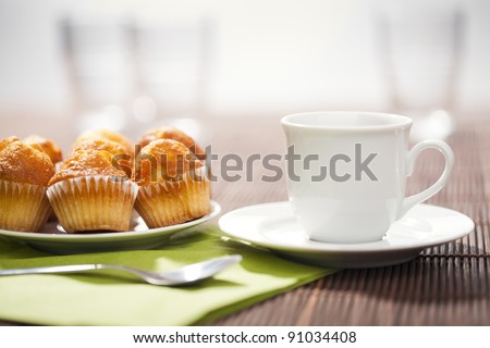 The perfect breakfast with hot coffee and muffins.
