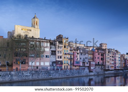Great twilight view of Girona with its Cathedral and river houses.