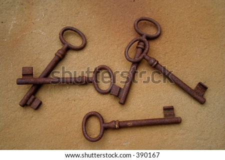 Rusty keys on the floor of stone
