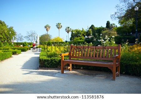 Bench in the park in Barcelona. Warm colors. Color corrected in LAB.