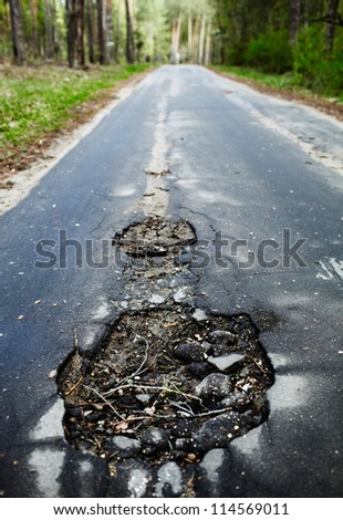 A hole in the road.